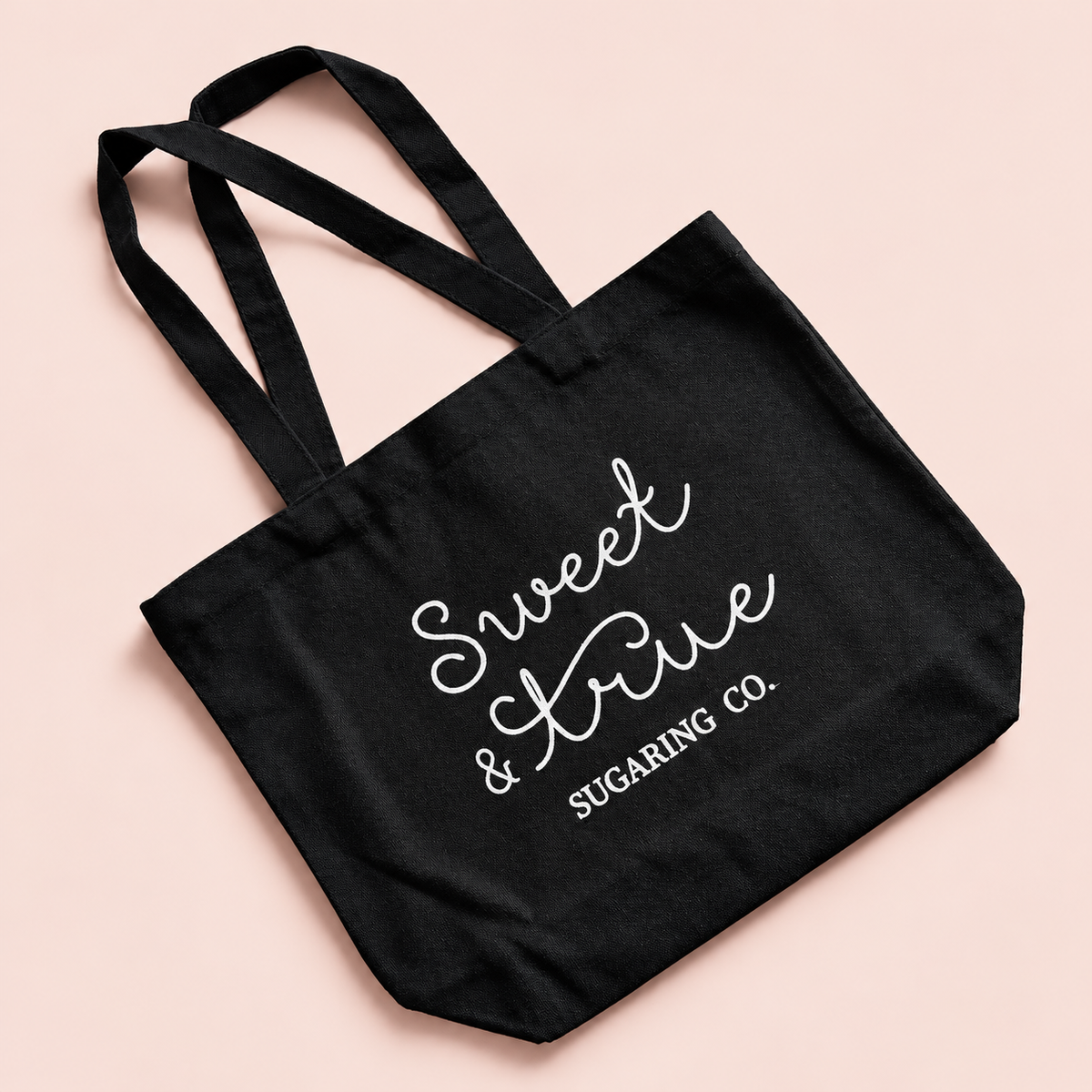 Sweet & True Sugaring Canvas Tote Bag on a blush studio background