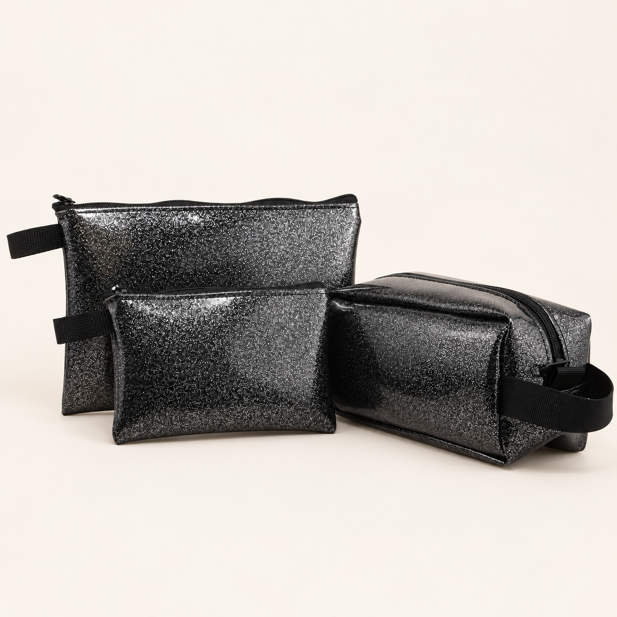 black small, large and Dopp sparkle pouches; sold separately