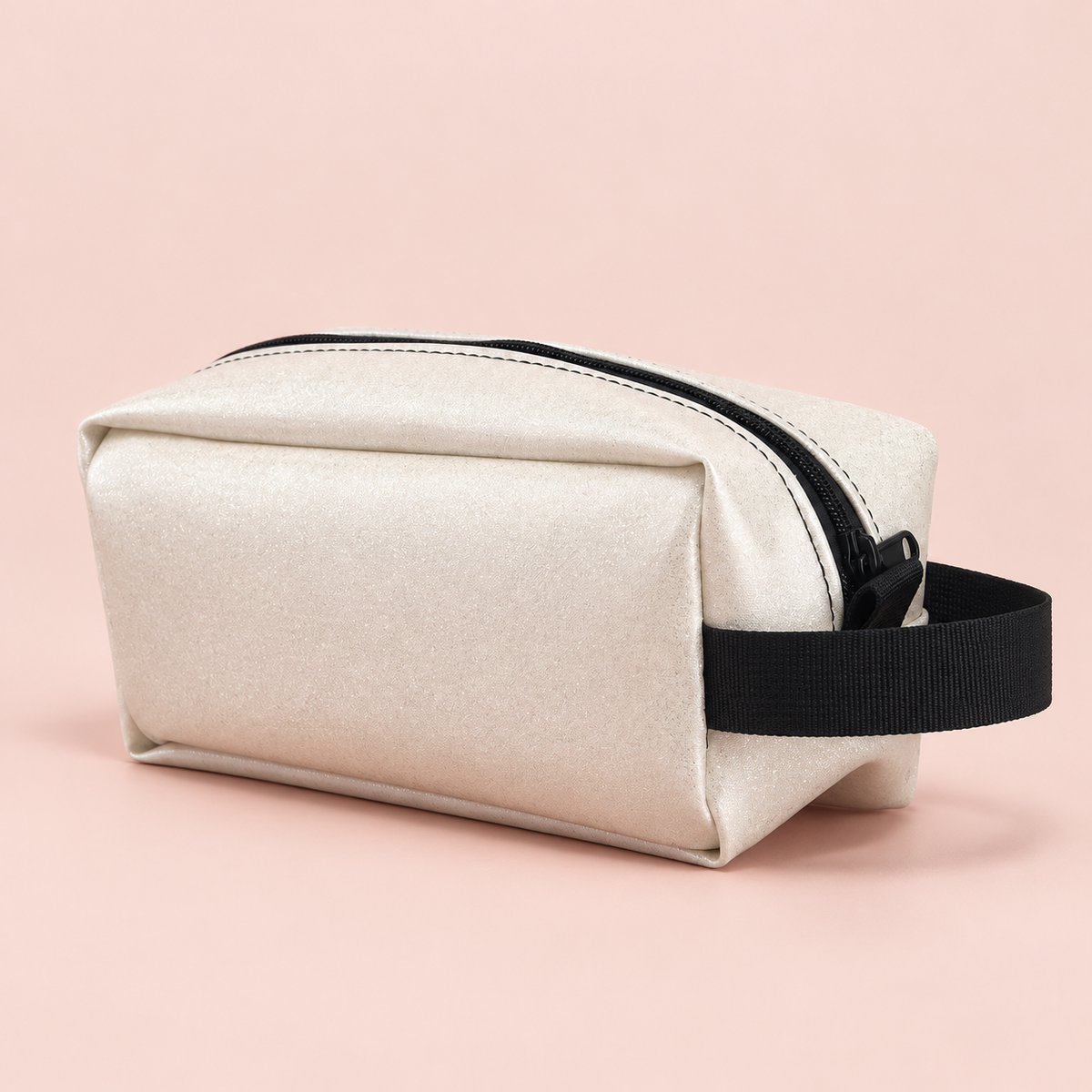 Dopp White Sparkle Pouch on a blush studio background